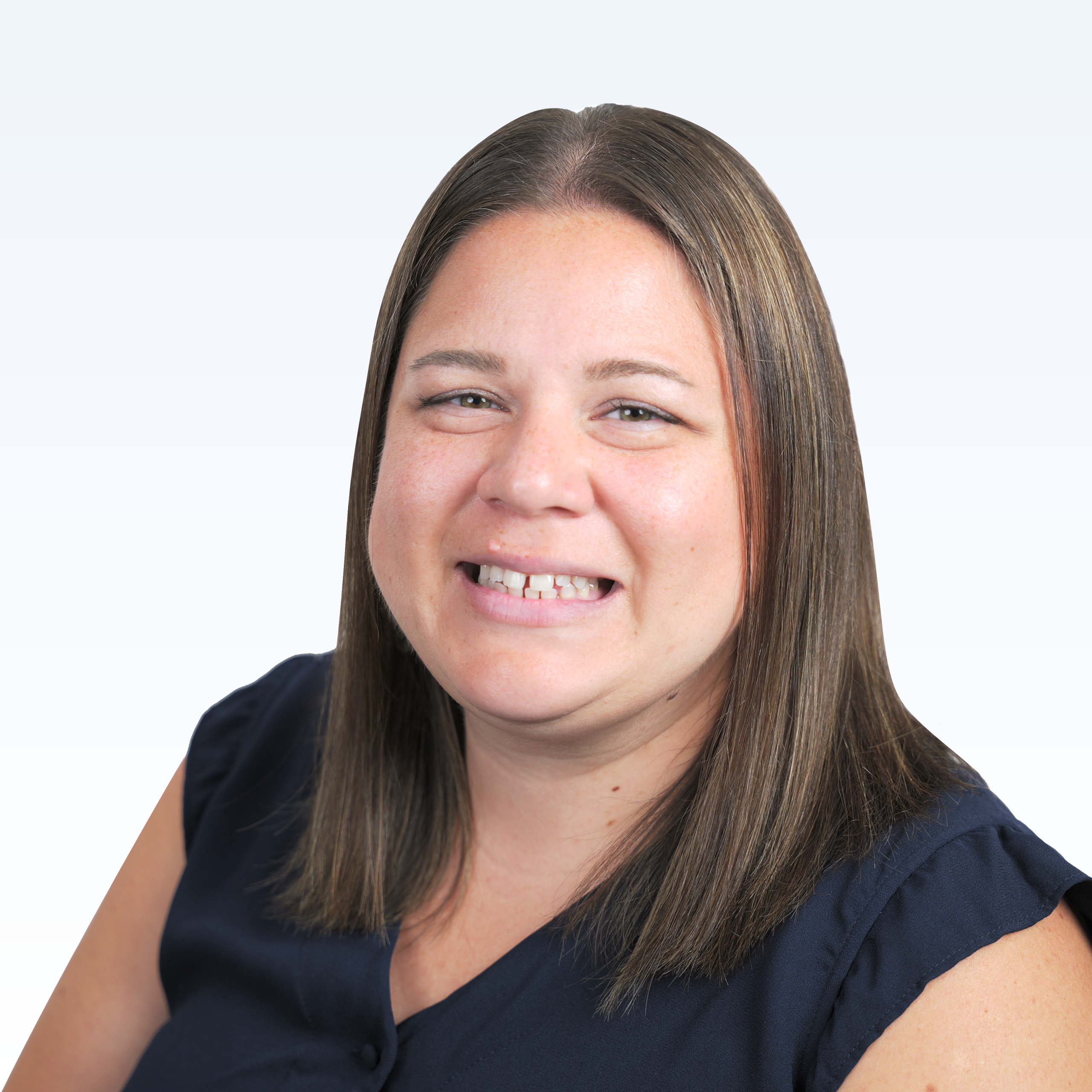 Smiling woman with straight, shoulder-length brown hair wearing a navy blue sleeveless blouse, shown against a light gradient background, evoking the approachable professionalism often seen among trusted providers.